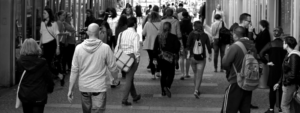 Black and white photo of a group of people walking